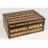 A CEYLONESE PORCUPINE QUILL BOX with fitted interior. 11ins wide.