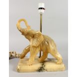 ANALABASTER ELEPHANT TABLE LAMP. 9ins long.