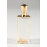 AN 18CT GOLD MOUNTED CUT GLASS SCENT BOTTLE. 3.5ins high.