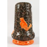 A CZECHOSLOVAKIAN POTTERY VASE, orange birds in relief. 11ins high.