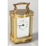 A VERY GOOD SMALL ASPREY FRENCH SERPENTINE SHAPED CARRIAGE CLOCK, made in England, battery operated.