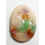 AN UNUSUAL CHINESE MULTI COLOURED CARVED JADE PENDANT. 2.25ins.