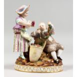 A GOOD 19TH CENTURY MEISSEN PORCELAIN GROUP, a young boy with a vine and grapes, the girl holding