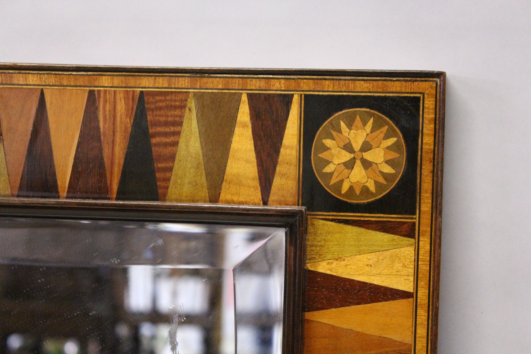 A REGENCY DESIGN RECTANGULAR MIRROR, with specimen wood sectional frame, the corners with an - Image 2 of 4