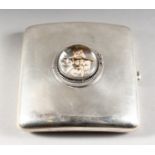 A PLAIN SILVER CIGARETTE CASE, inset with an Essex crystal of three cats. Birmingham 1925.