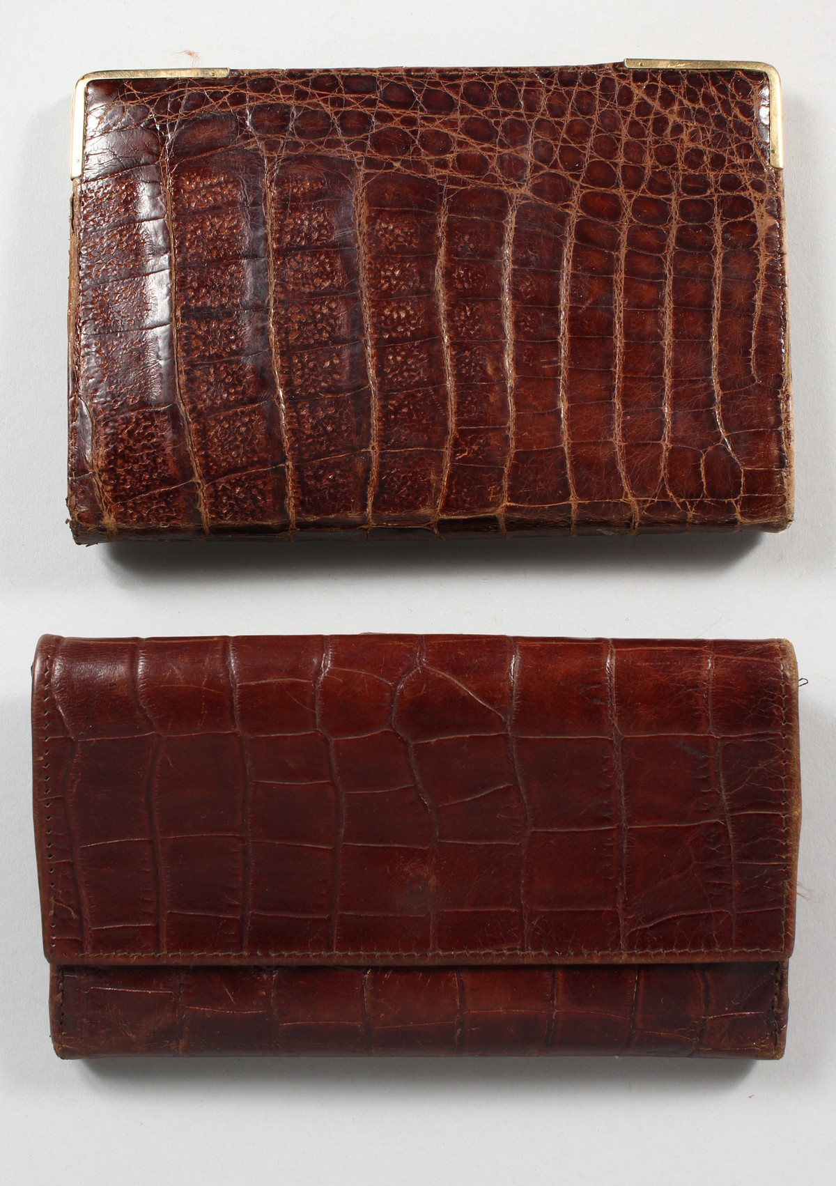 A CROCODILE LEATHER PURSE AND SIMILAR WALLET. 6.5ins wide.