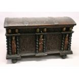 A LARGE AND IMPRESSIVE CONTINENTAL STAINED PINE DOME TOP COFFER, initialled and dated 1700, the