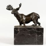 A SMALL BRONZE FIGURE OF A MOOSE IN A RIVER, mounted on a marble plinth. 6ins long.