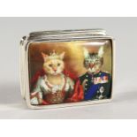 A SILVER BOOK SHAPED PILL BOX, the lid with an enamel of two cats.. 1ins diameter.