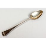 A GEORGE III LONG HANDLED GRAVY SPOON. London 1789. Maker Thomas Dealtry.