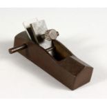 A JAPANESE BRONZE MINIATURE WOODWORKING PLANE. 3.5ins long.