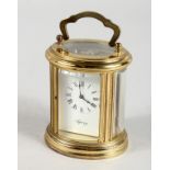 A VERY GOOD SMALL ASPREY FRENCH OVAL CARRIAGE CLOCK, with white dial, black Roman numerals and
