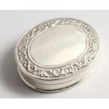 A LARGE SILVER OVAL SECRETS PILL BOX, the interior with a nude.