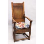 A 17TH / 18TH CENTURY LAMBING CHAIR, possibly fruitwood, with shaped cresting, plain panel back,
