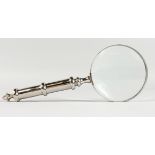 A MAGNIFYING GLASS with plated handle.