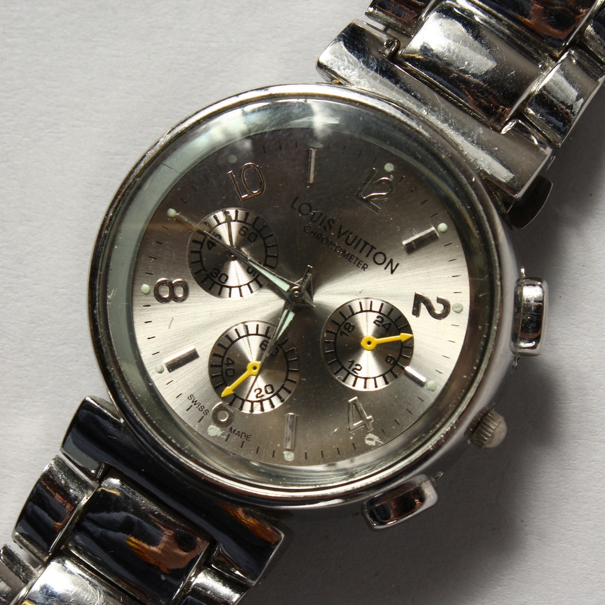 A GENTLEMAN'S LOUIS VUITTON WRISTWATCH with three dials.