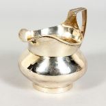 A GEORGE III SILVER MILK JUG of circular form. London 1805.