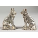 A PAIR OF .925 SILVER PLATE DOG SALT AND PEPPERS.
