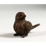 A JAPANESE BRONZE MINIATURE MODEL OF A BIRD. 2ins long.