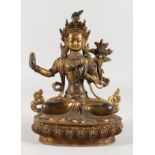 A THAI GILT BRONZE SEATED DEITY, inlaid with semi-precious stones. 8.5ins high.