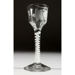 A GEORGIAN WINE GLASS, the bowl engraved with fruiting vines with white twist stem. 5.75ins high.