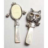 TWO SILVER MOTHER-OF-PEARL CAT BABY'S RATTLES.