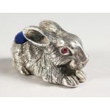 A LARGE SILVER RABBIT PIN CUSHION.