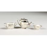 A MINIATURE SILVER THREE PIECE TEA SET.