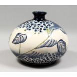 IN THE MANNER OF MOORCROFT, a large bulbous shaped vase. 14ins wide.