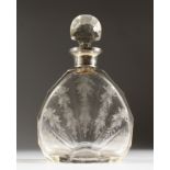 A FINELY ENGRAVED DECANTER AND STOPPER with silver band.