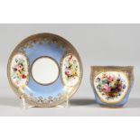A GOOD 18TH CENTURY SEVRES LILAC GROUND CUP AND SAUCER, edged in gilt and painted with flowers