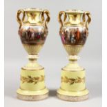 A SUPERB PAIR OF 19TH CENTURY VIENNA YELLOW GROUND TWO HANDLED VASES ON STANDS with gilt decoration,