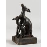 AN UNUSUAL CHINESE BRONZE SEAL MODELLED AS TWO DEER. 5ins high.