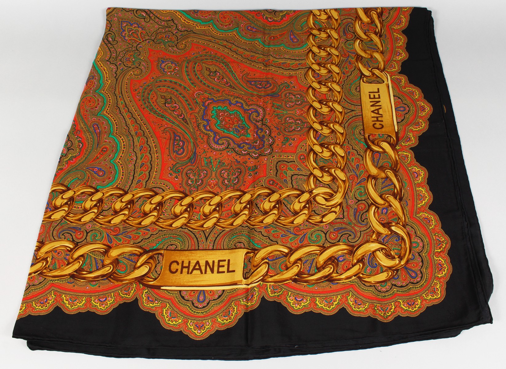 A VINTAGE CHANEL SILK SCARF, BLUE PAISLEY DESIGN.