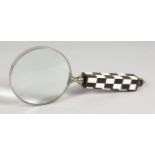 A LARGE MAGNIFYING GLASS with black & white handle.