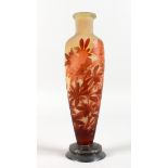 A GALLE GLASS VASE, relief etched with red flowers, on a silver base. 10.5ins high.