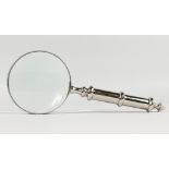 A MAGNIFYING GLASS with plated handle.