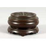 A SMALL JAPANESE CIRCULAR CENSER ON STAND. 2.75ins diameter.