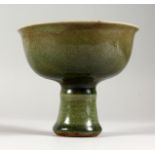 A CHINESE CELADON PORCELAIN STEM CUP. 4.5ins high.