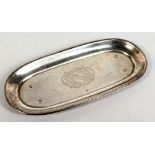 A GEORGE I RECTANGULAR SHAPED SILVER SPOON TRAY with shaped ends, crested. 6.25ins long. London