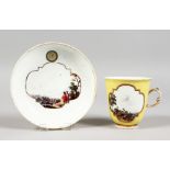 A GOOD 18TH CENTURY MEISSEN PORCELAIN YELLOW GROUND CUP AND SAUCER, the cup with two scenes of