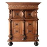A GOOD 17TH CENTURY FLEMISH OAK CUPBOARD, with carved cornice and frieze, carved with a vase and