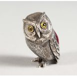 A SILVER OWL PIN CUSHION.