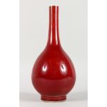 A CHINESE SANG DE BOEUF BOTTLE VASE. 10.5ins high.