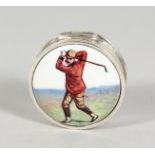 A SILVER CIRCULAR GOLF PILL BOX, with enamel top. 1ins diameter.