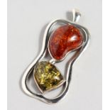 A SILVER AND AMBER PENDANT. 2.5ins high.