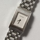 A LADIES' BOUCHERON STAINLESS STEEL WRISTWATCH No. AK 416582 in a white Boucheron pouch.