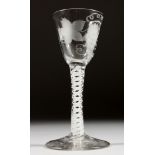A GEORGIAN WINE GLASS, the bowl engraved with fruiting vines with white twist stem. 5.25ins high.