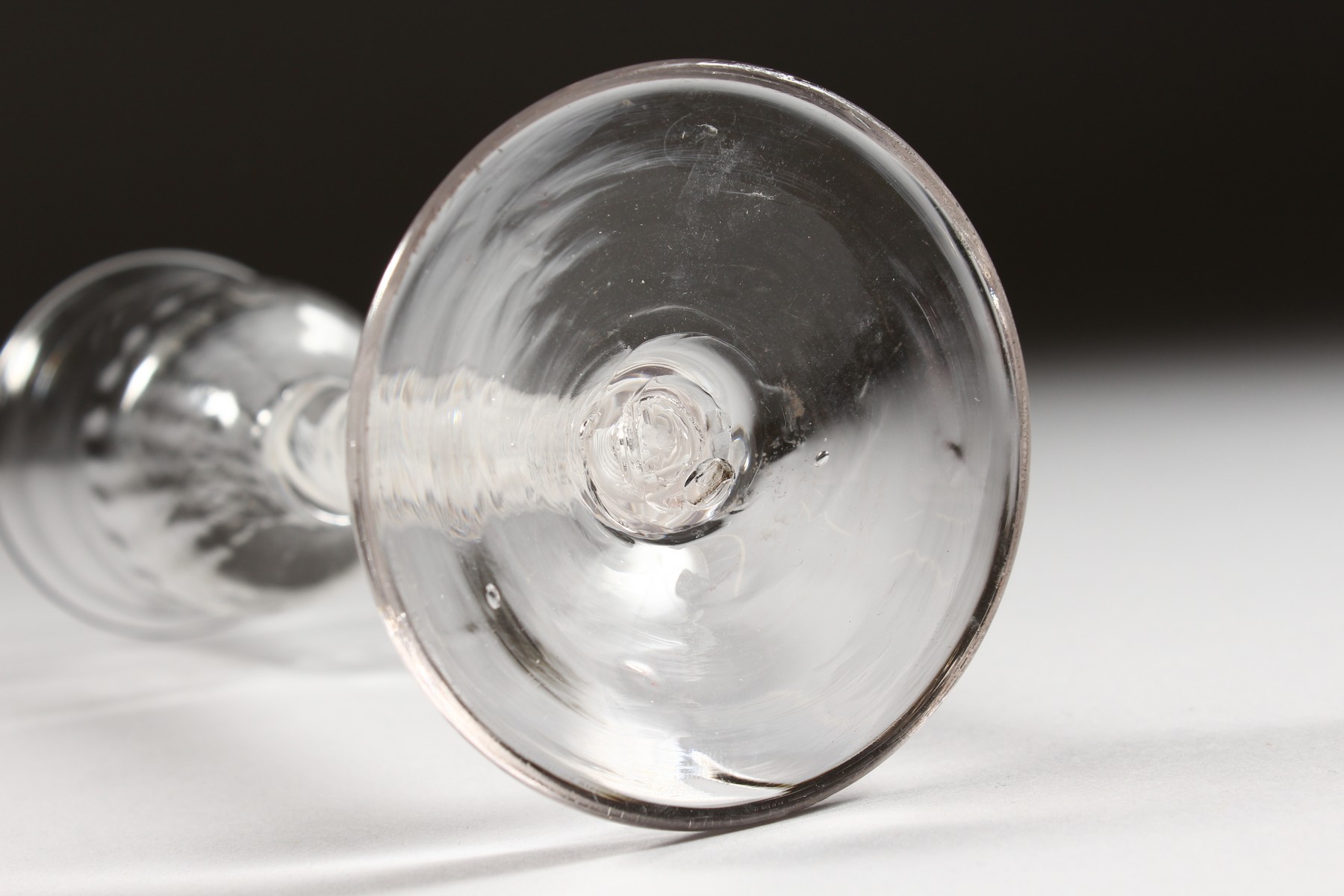 A GEORGIAN WINE GLASS with semi fluted bowl and white twist stem. 5.5ins high. - Image 4 of 4