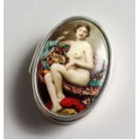 AN OVAL SILVER PILL BOX, the top with an enamel of a nude.